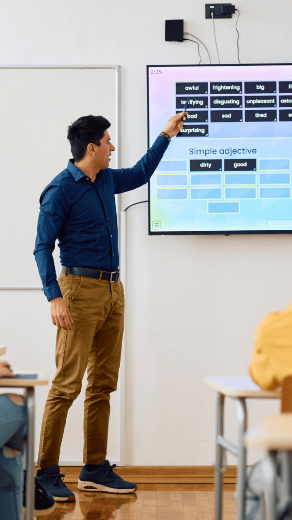 Teacher teaching with the help of digital board